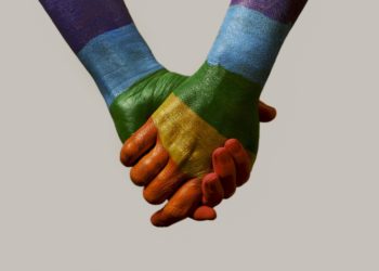 Hands holding with rainbow flag poster